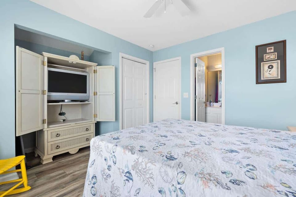 Spacious queen bedroom with private bath and walk-in shower.