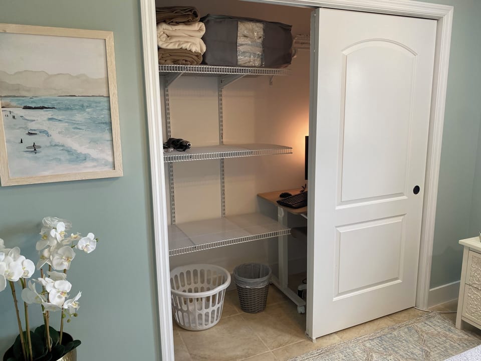 Large closet with rolling work desk that can move to wherever needed