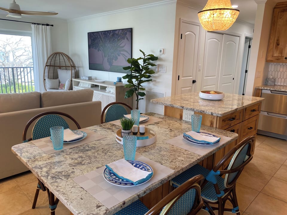 Dining for 4, plus can add balcony bar height chairs for additional seating
