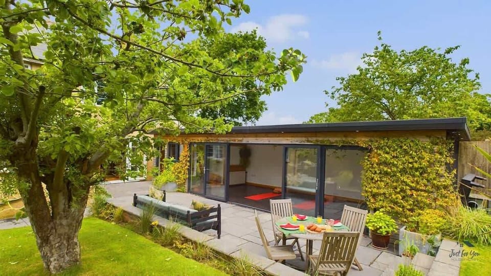 Exterior view of the yoga cabin at The Timbers, set in the garden.