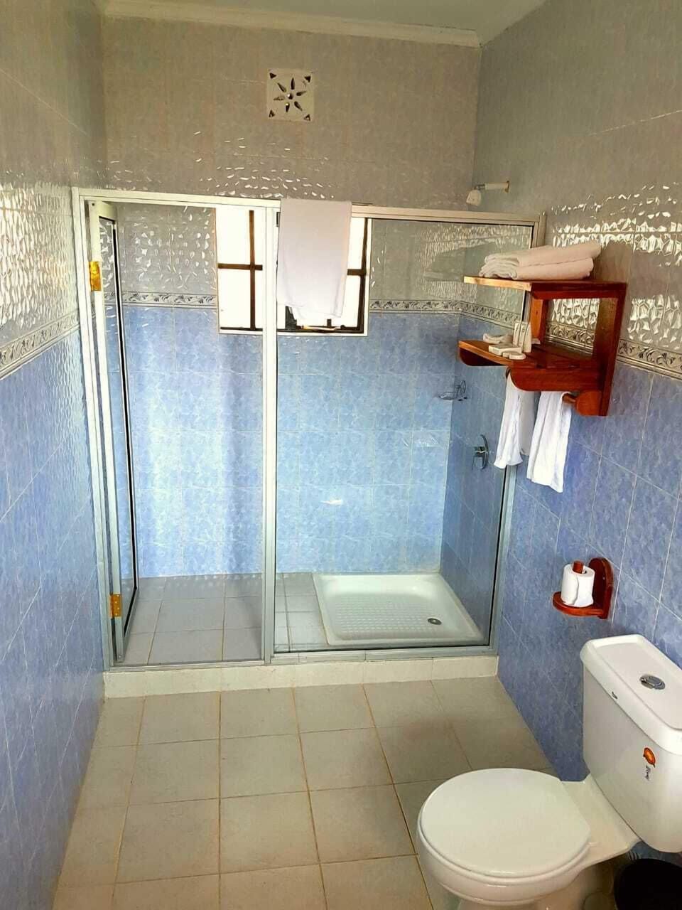 Deluxe Double or Twin Room, Balcony, Garden View | Bathroom | Combined shower/tub, hair dryer, slippers, towels