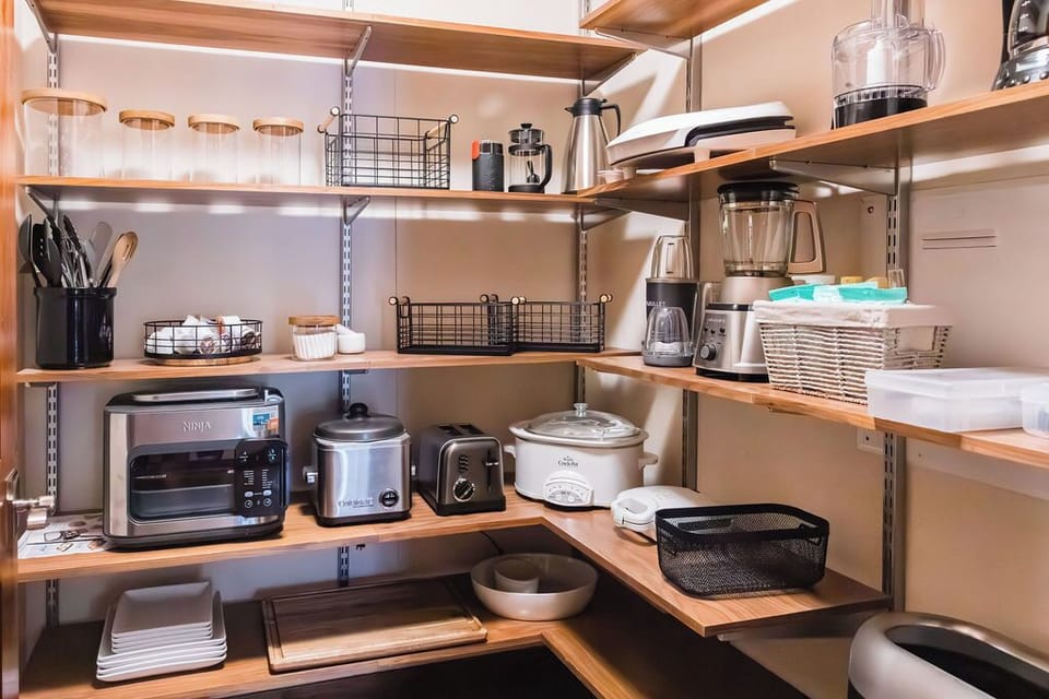 Pantry Perfection — Stocked with high-end appliances and entertaining extras, from waffle makers to platters and everything in between. 🧇✨