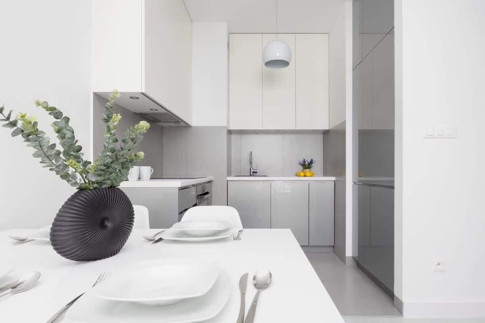 Kitchenette with oven and refrigerator. 