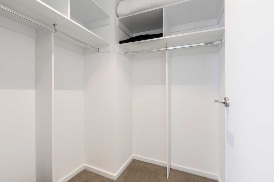 MASTER BEDROOM: Generous walk-in wardrobe space provides plenty of room to store your belongings