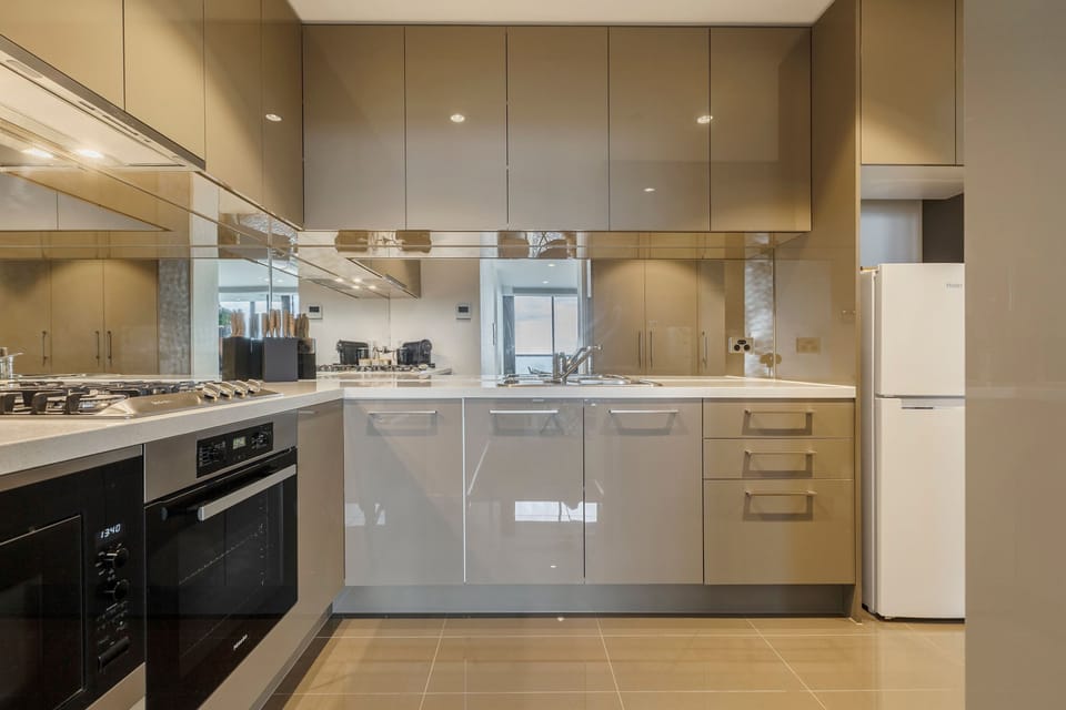 KITCHEN: Sleek, stylish, and fully equipped with everything you need to create a gourmet meal, entertain with ease, or enjoy a effortless takeout night