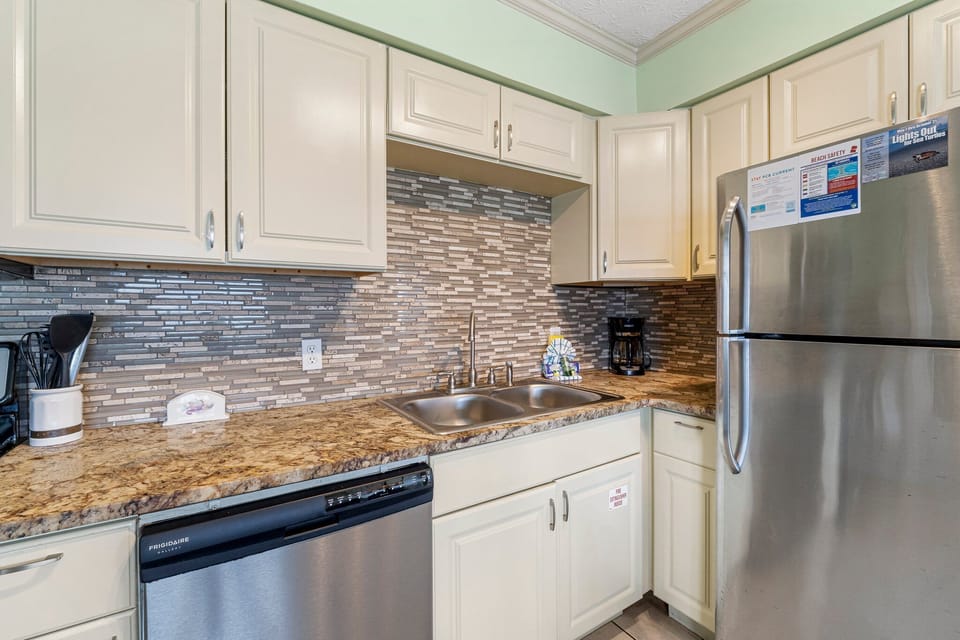 This adorable unit offers guests a full kitchen with stainless-steel appliances and everything you need to prepare meals for family and friends.