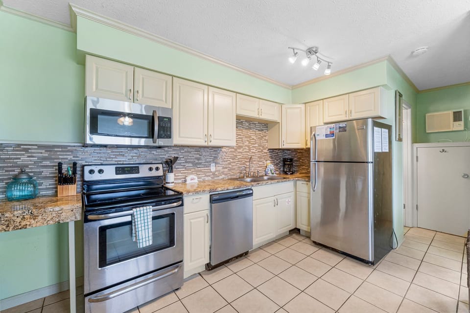 This adorable unit offers guests a full kitchen with stainless-steel appliances and everything you need to prepare meals for family and friends.
