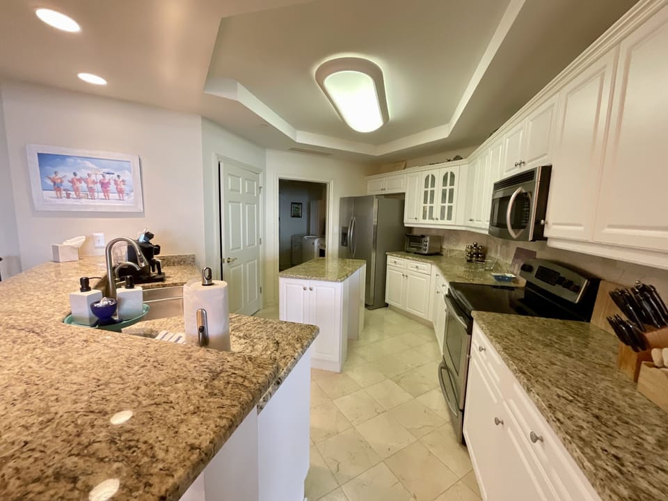 Condo, 4 Bedrooms | Private kitchen | Coffee/tea maker, fridge, oven, toaster