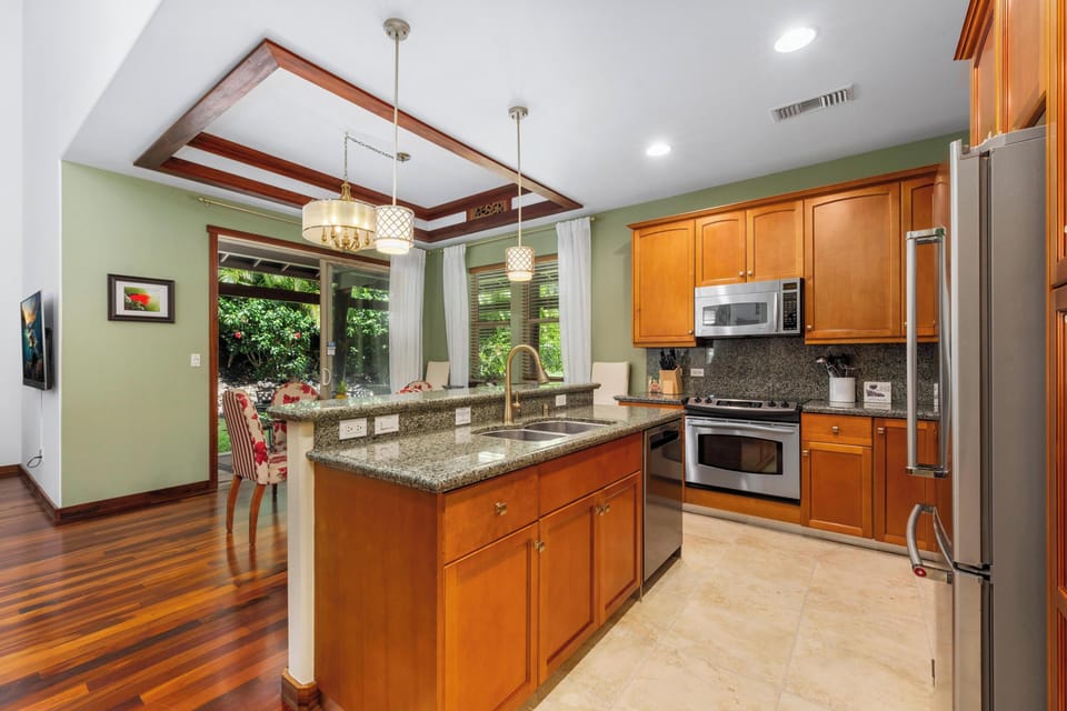Full kitchen with granite counters and stainless steel appliances