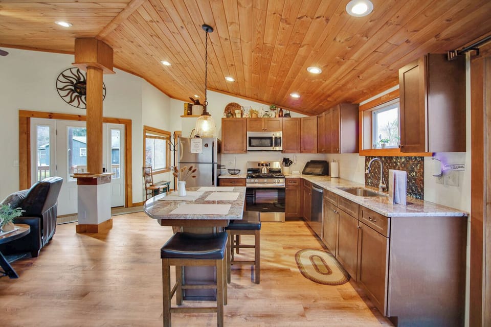 Fully stocked kitchen with island seating.