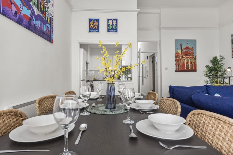 Dining area with a view towards the balcony, emphasizing indoor-outdoor connectivity