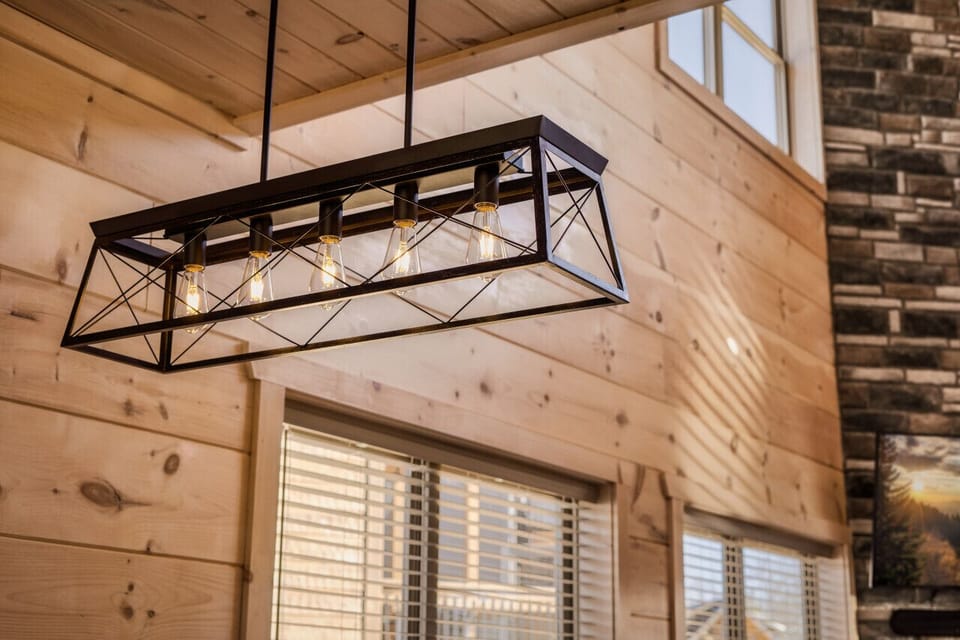 Stunning open-concept living area with soaring ceilings and cozy fireplace vibes!