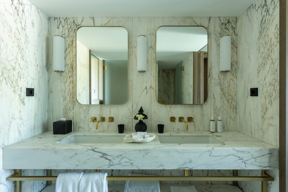 Shower, designer toiletries, hair dryer, bathrobes