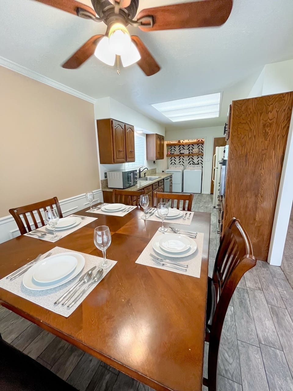 Beautifully lit dining area with a large window. Comfortably seats 6