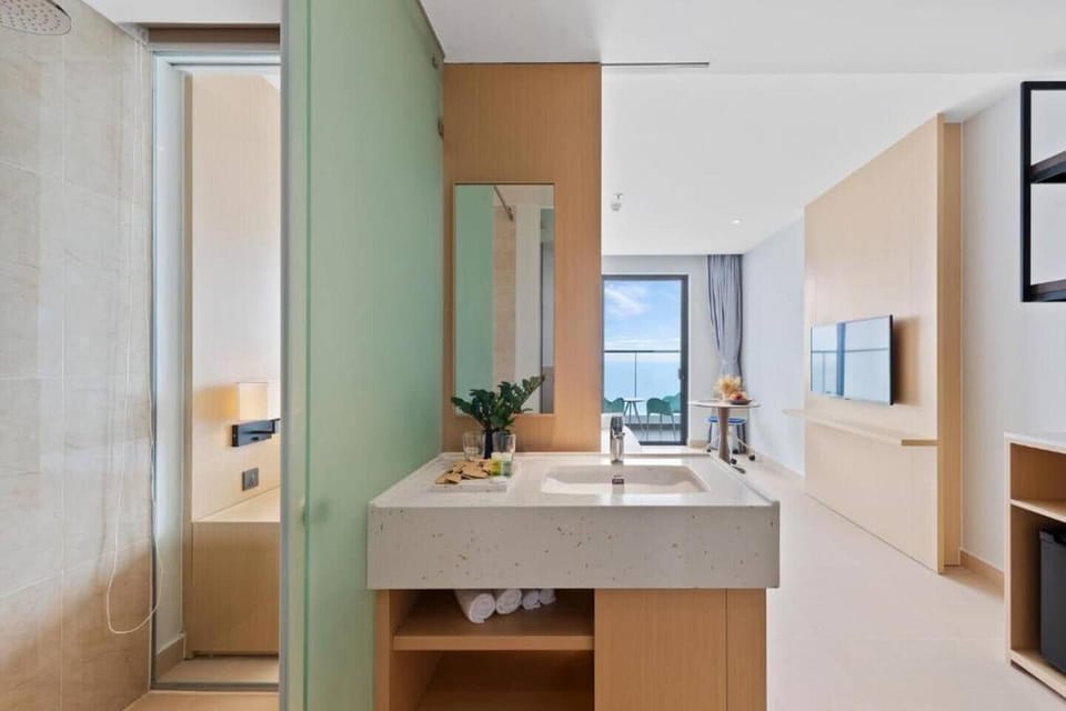 Shower, rainfall showerhead, hair dryer (on request), bathrobes