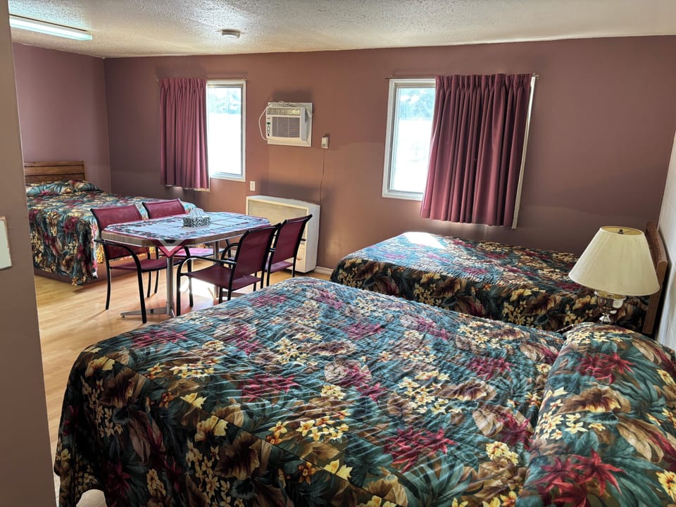 Deluxe Room, Multiple Beds, City View | Laptop workspace, WiFi (free), bed sheets