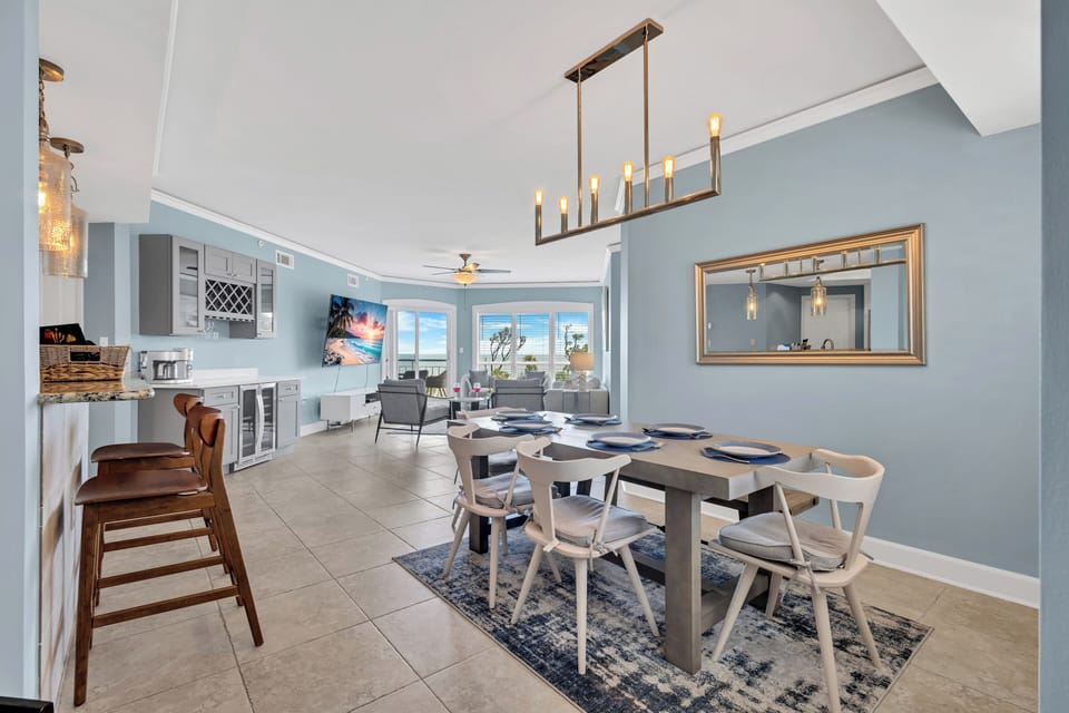 The condo features new contemporary furnishings and open concept living and dining areas