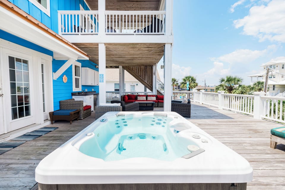 Soak your cares away in this private hot tub while taking in coastal views from your spacious deck.