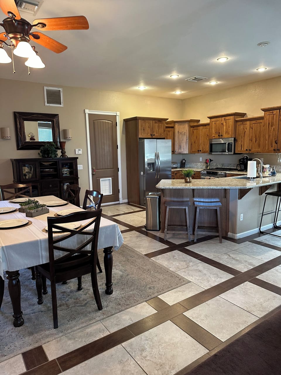 View of dining room, kitchen with bar and seating for six people!
