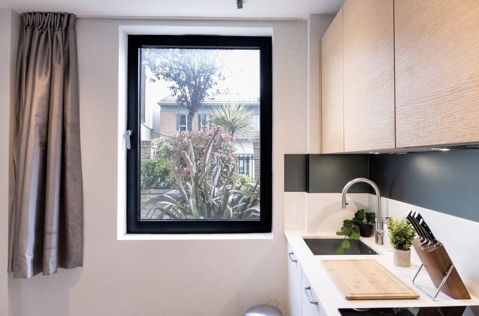 Fully equipped kitchen with amenities such as a dishwasher, Nespresso machine, and induction hob