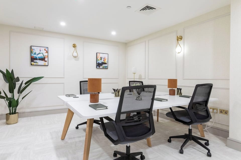 Shared Office Workspace: A common area used by multiple residents for work