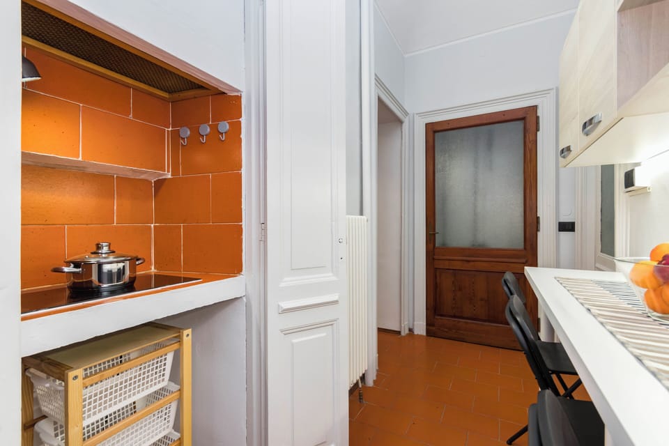 Condo | Private kitchen | Espresso maker, highchair, dining tables