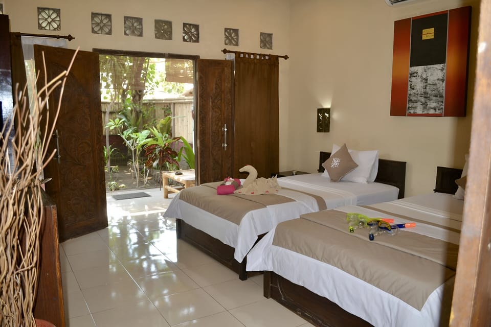 Twin Room, Garden View | Minibar, in-room safe, WiFi (free), individually decorated