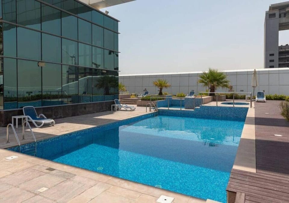 Outdoor pool, open 8:00 AM to 7:00 PM, lifeguards on site
