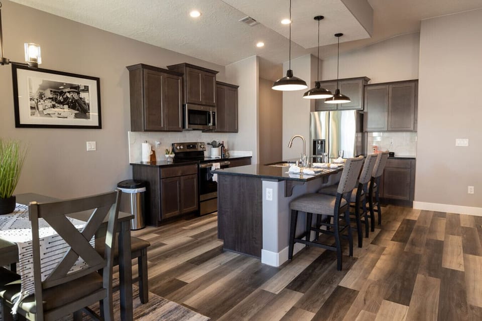 Fully stocked kitchen with plentiful dining seating for all.