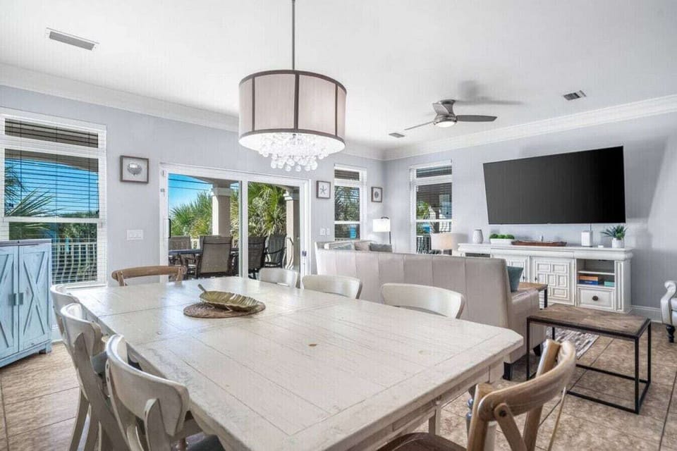 Gather around this spacious dining table where your group can share meals and make memories in this beautifully appointed open-concept space.