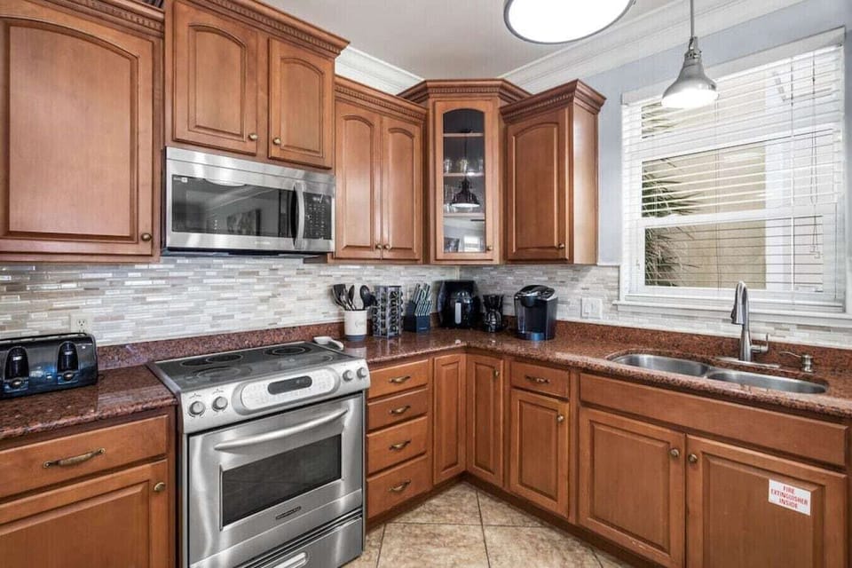 Your fully equipped kitchen awaits with granite counters, stainless appliances, and everything needed to create memorable meals during your stay.