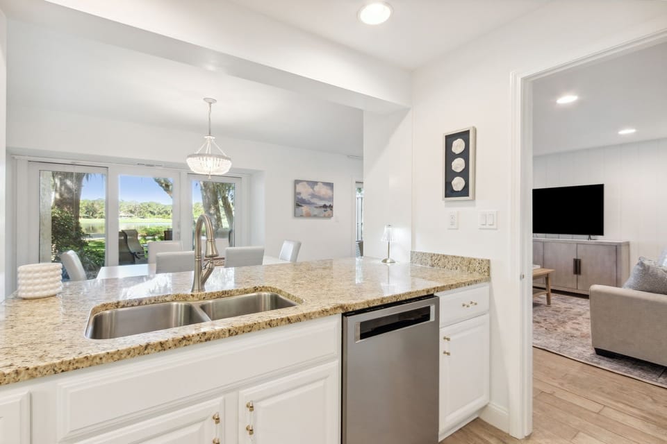 Updated Kitchen with Pristine White Cabinetry, Granite Countertops and Stainless Steel Appliances