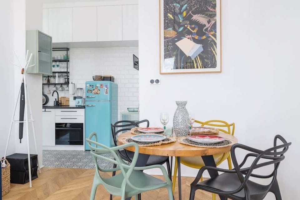 Large table with chairs for eating communal meals. 