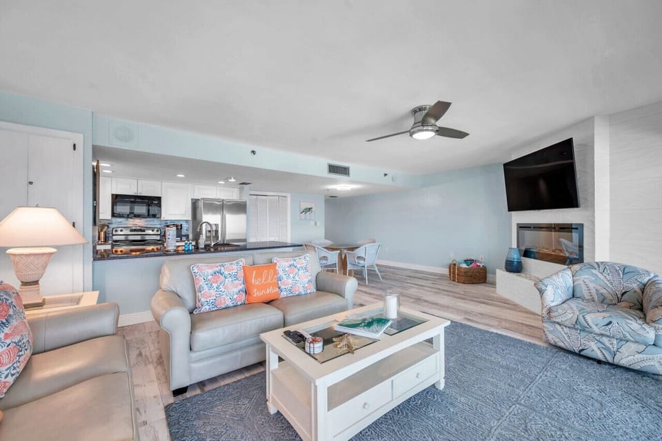 Open living room w/ plush seating, patterned pillows, & a relaxed setup for easy downtime.