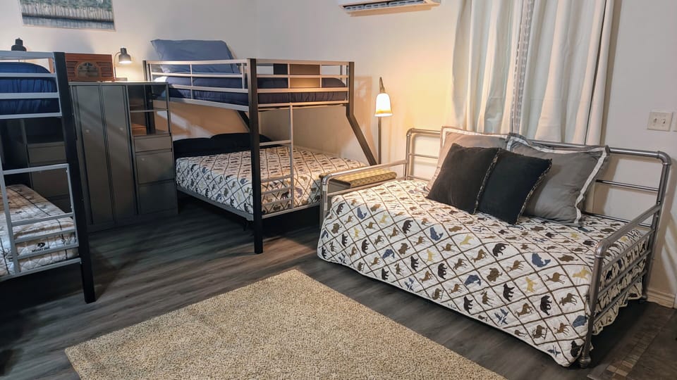 Gameroom/Bunkhouse daybed w/ futon and 1 of 2 bunk beds.