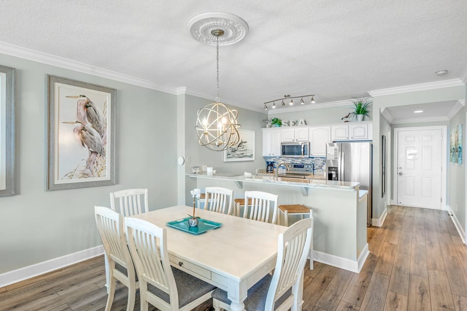 There is a dining table that seats 6. The perfect place to enjoy a meal or play a game.