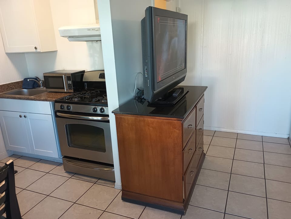 Classic Studio, 2 Double Beds, Kitchen, Garden Area | Living area | TV