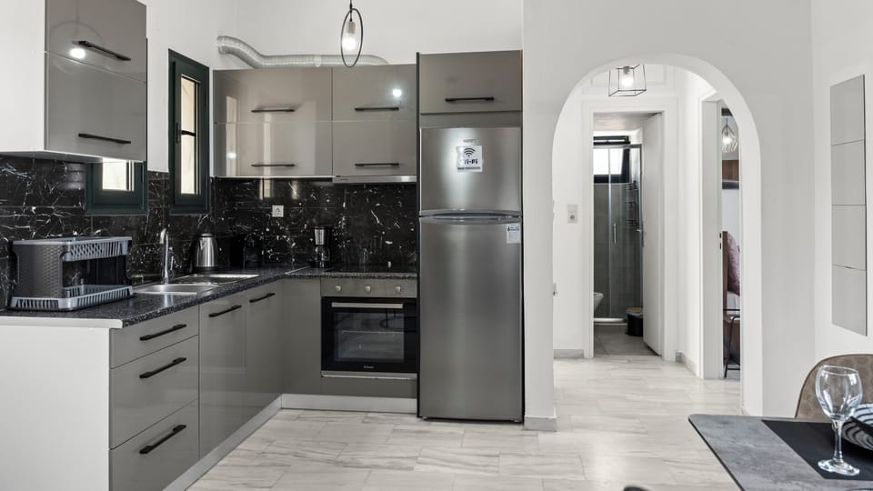 Family Suite, 2 Bedrooms, Balcony, Garden View | Private kitchen | Highchair