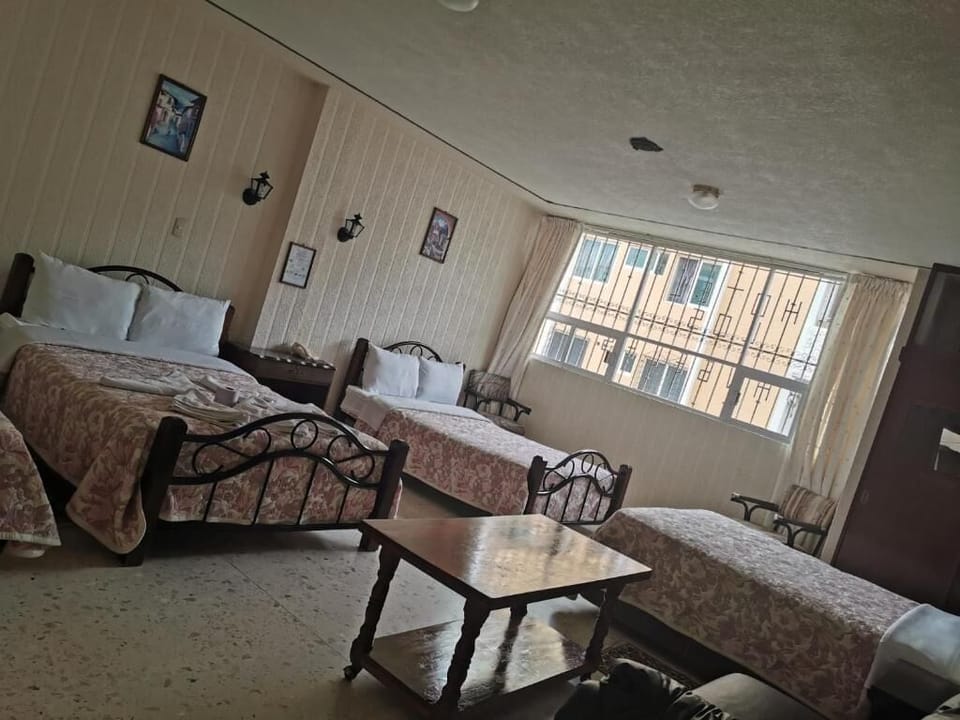 Family Quadruple Room | Desk, blackout drapes, free WiFi, bed sheets