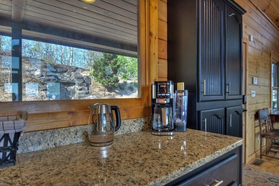 Fully equipped kitchen on the main level with hot water kettle and a Ninja coffee maker to accommodate all types of coffee lovers.