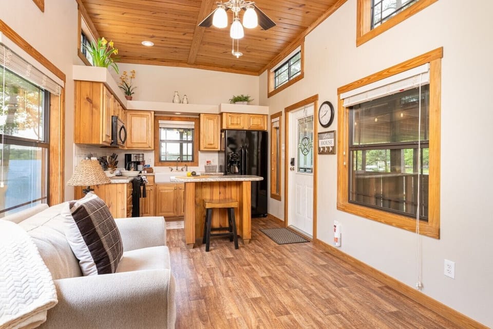 Living room & island kitchen with high ceilings