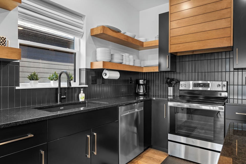 Coffee lovers, you’re in luck, this kitchen includes a drip brewer, crock pot, and everything you need to start your day right.
