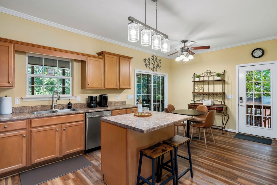 Sliding doors offer direct access to screen porch from fully equipped kitchen.