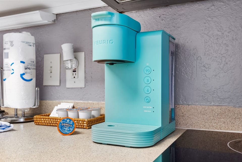 Start your day right with our cozy coffee station, fully stocked for your perfect brew!