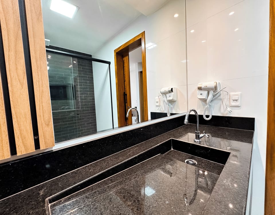 Comfort Room, Lanai | Bathroom | Shower, rainfall showerhead, hair dryer, towels