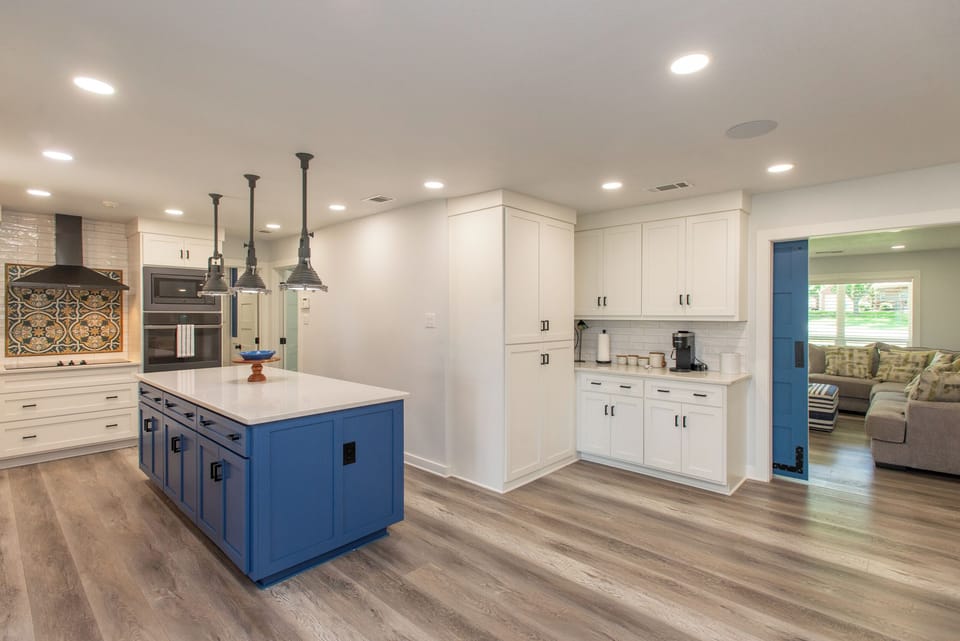 Spacious kitchen and dining area with a guest bedroom conveniently located.