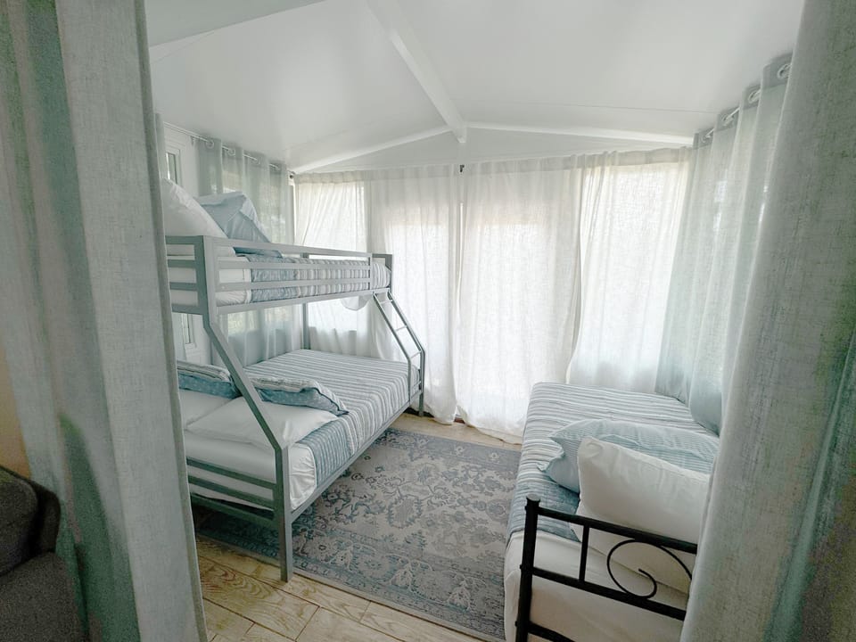 Bonus 3rd bedroom has a vibe of a lake cabin with nature  sounds from the lake