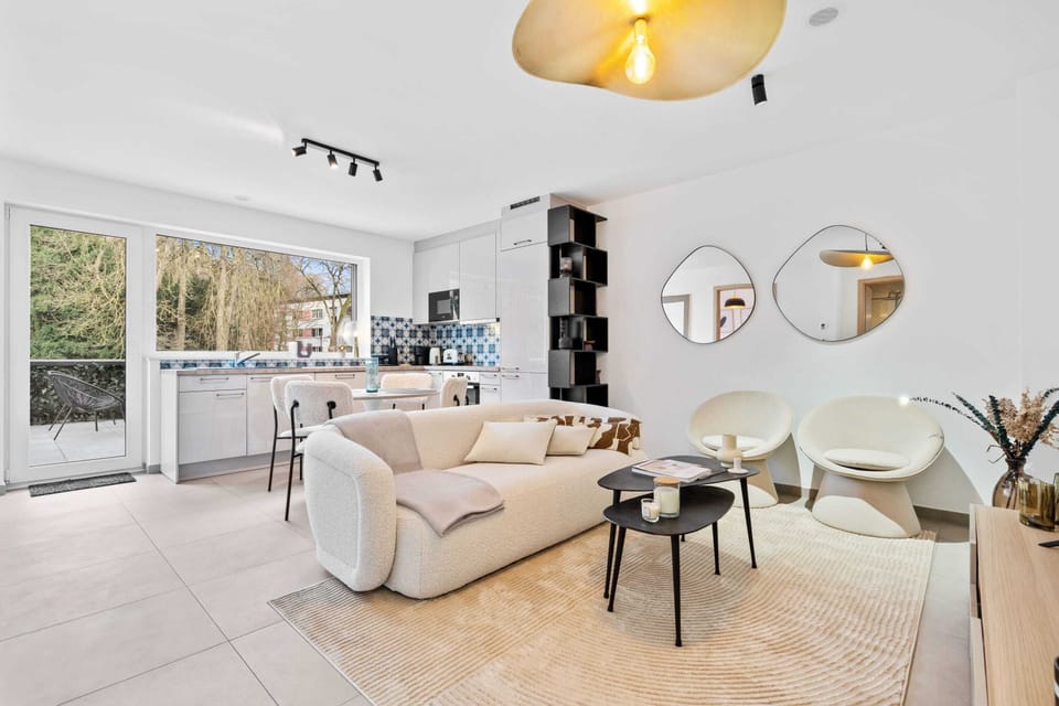 Chic & cozy lounge space with a touch of modern decor and natural light.
