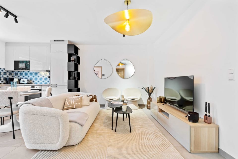 Relax in style - where comfort meets sleek design in our living area.