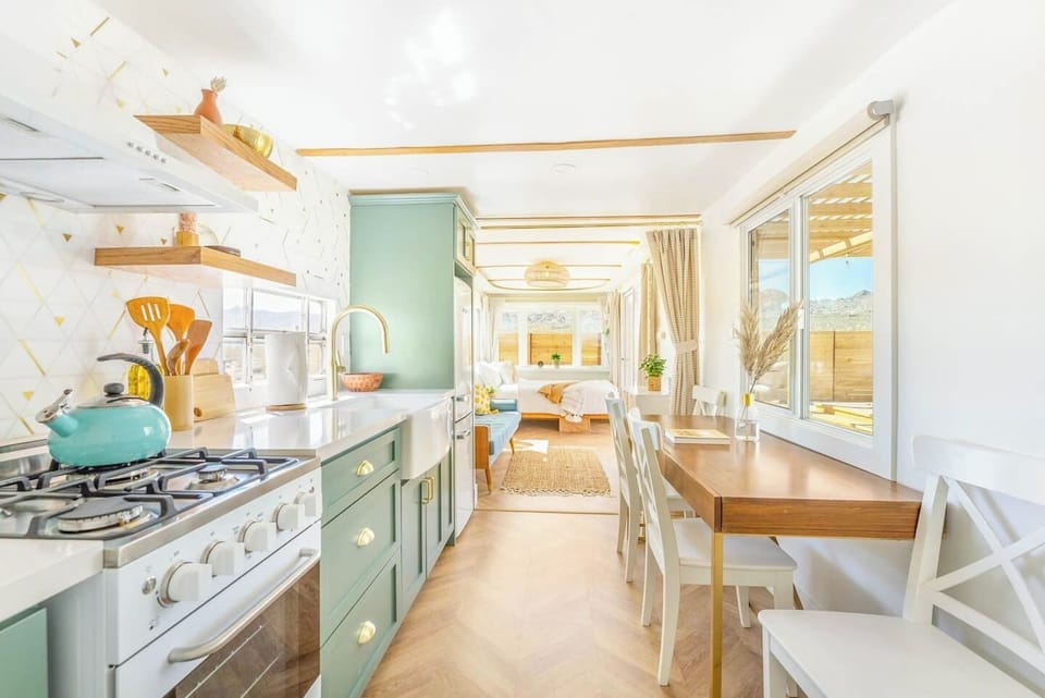 This full kitchen is as functional as it is beautiful. Full stove + appliances and a view of the mountains while enjoying your lunch? Can`t beat it.